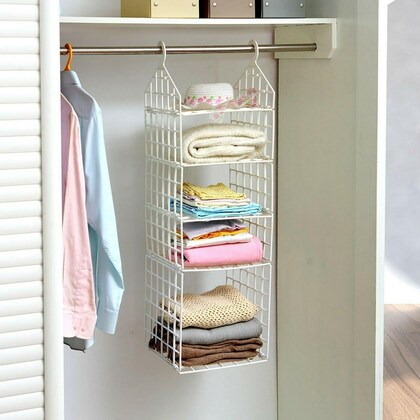 Front view of a 5-layer folding hanging clothes rack showing five ventilated tiers with garments and accessories in a closet space.